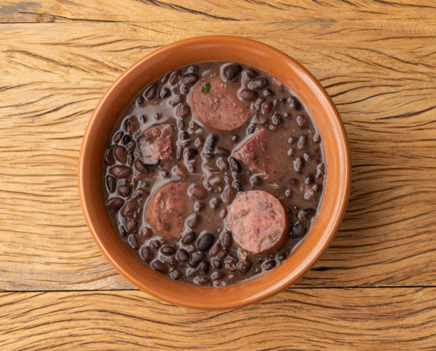 istock Traditional brazilian feijoada in a bowl over wooden table 1407333966