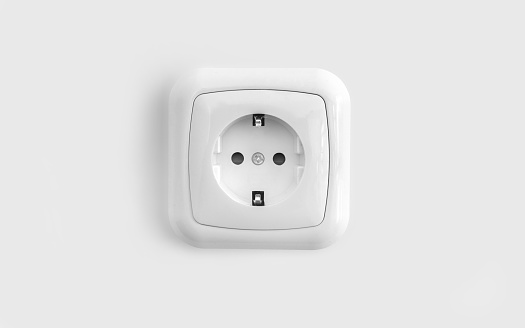 European power outlet on smooth white wall