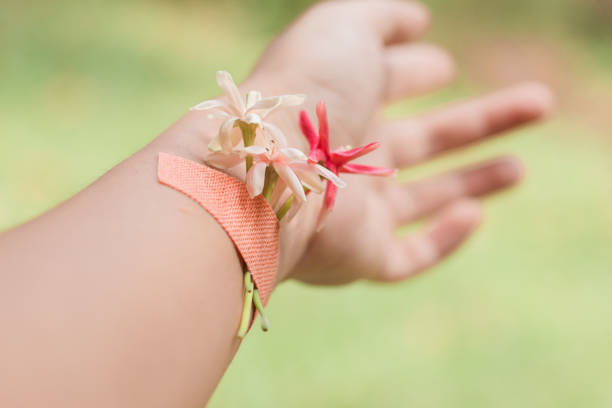 istock Dainty flowers plastered in a woman's wrist 1407335989