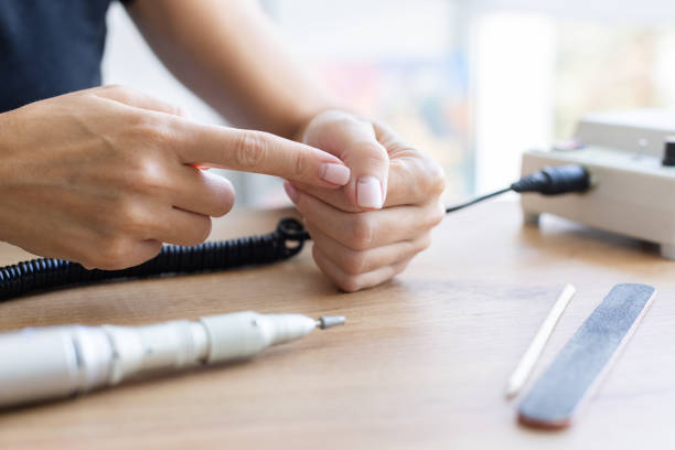 istock Cracked broken nail. Nail weakness damage from gel polish coating. 1407338354