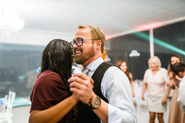 istock Couple dancing at graduation party 1407339756