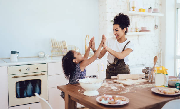 Daughter and mother celebrating cooking success