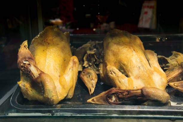 Steamed whole chickens on a glass display Steamed whole chickens on a glass display at a traditional Khmer noodle shop in Mondulkiri, Cambodia mondulkiri province photos stock pictures, royalty-free photos & images