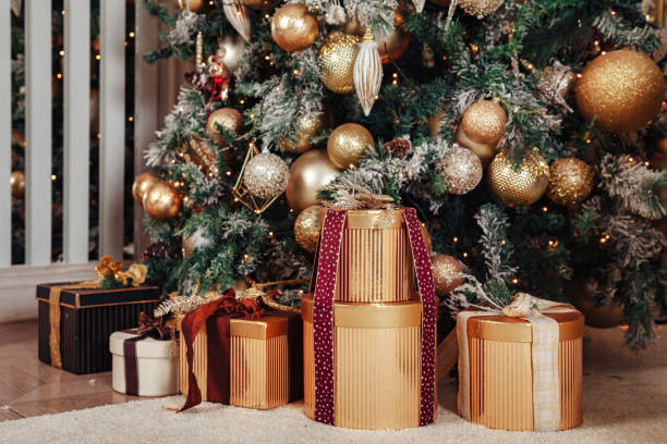 istock Christmas and new year decor background gold gift boxes 1407342382
