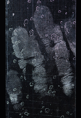 Fingerptint on transparent adhesive tape or strips isolated on black background