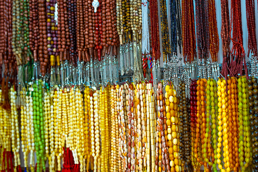 Closeup to rosaries with different materials, colors and shapes