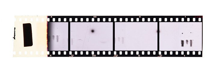long and underexposed dia positive film strip isolated on white background,35mm film strip