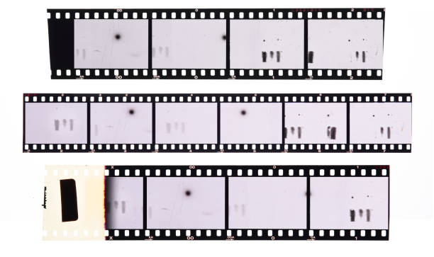 long and underexposed dia positive film strip isolated on white background,35mm film strip long and underexposed dia positive film strip isolated on white background,35mm film strip black border photos stock pictures, royalty-free photos & images