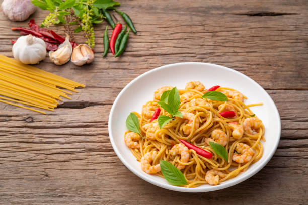 istock stir fried spicy spaghetti with shrimp and basil 1407348436