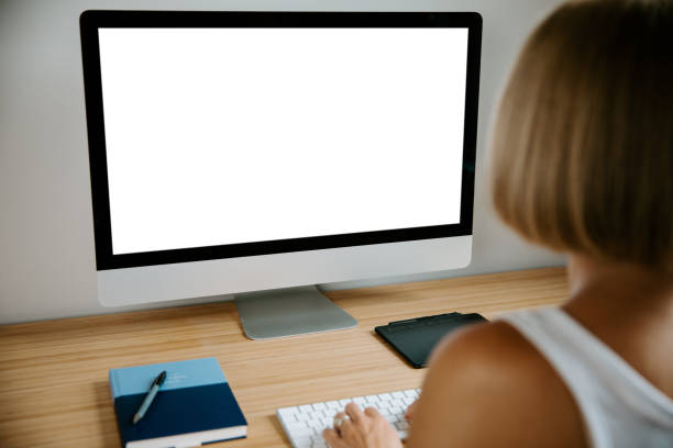 istock Woman Working At Home With Blank Screen Pc 1407352393