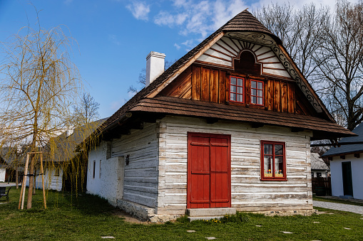 Hlinsko, Vysocina, Czech Republic, 15 April 2022: Traditional village wooden farm house at summer sunny day, historic country-style architecture in Skanzen, Easter at Open-air museum Betlem Hlinsko
