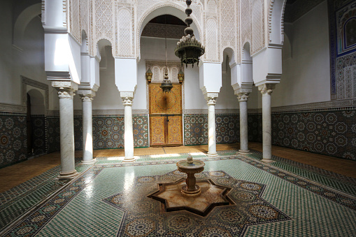 Meknes, Morocco-September 22, 2013: Architectural section from the columns and small pool inside the Moulay Ismail Tomb.