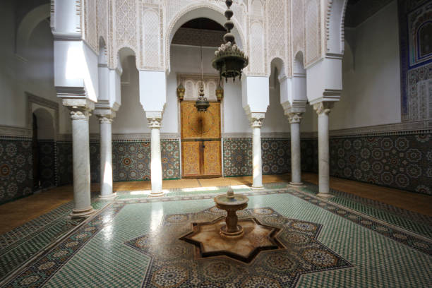 Architectural section from the columns and small pool inside the Moulay Ismail Tomb Meknes, Morocco-September 22, 2013: Architectural section from the columns and small pool inside the Moulay Ismail Tomb. meknes stock pictures, royalty-free photos & images