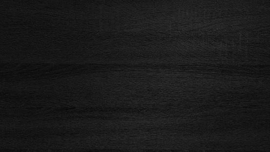 dark black melamine wood texture use as background. abstract rough wood material for interior finishing, furnishing works. wood texture with natural pattern for inner design and background.