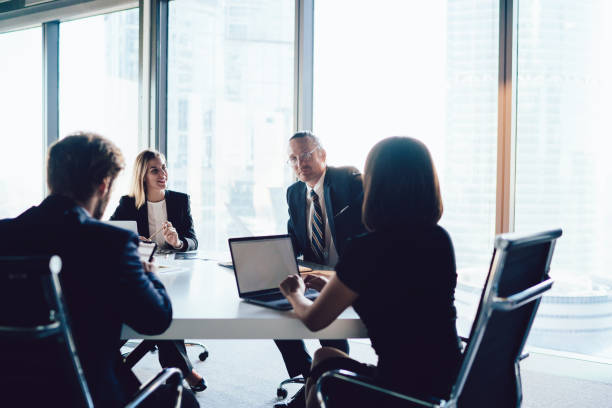 istock Group of modern colleagues on meeting in conference hall 1407354573
