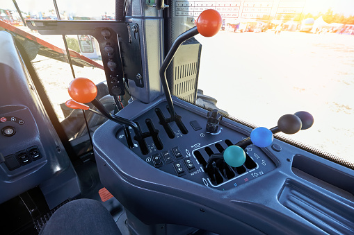 Control panel in the cab of a modern tractor, for agricultural or construction work.
