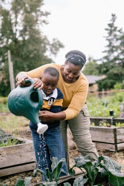 istock Mother Gardening With Her Children 1407356460