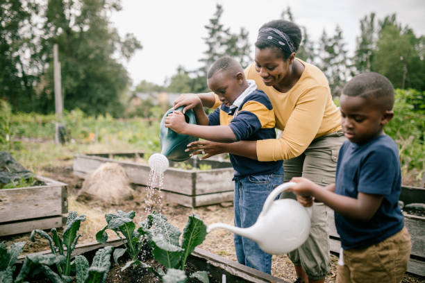 istock Mother Gardening With Her Children 1407356461
