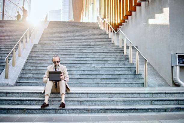 istock Businessman working outdoors 1407358371