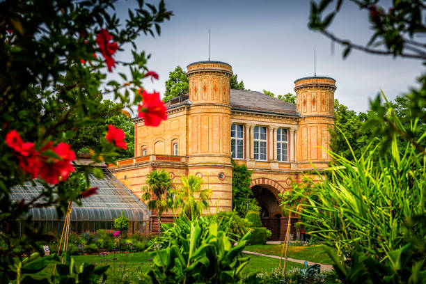Kassel, Germany - May 08, 2018: Yellow castle in the Karlsaue park of Kassel, Germany