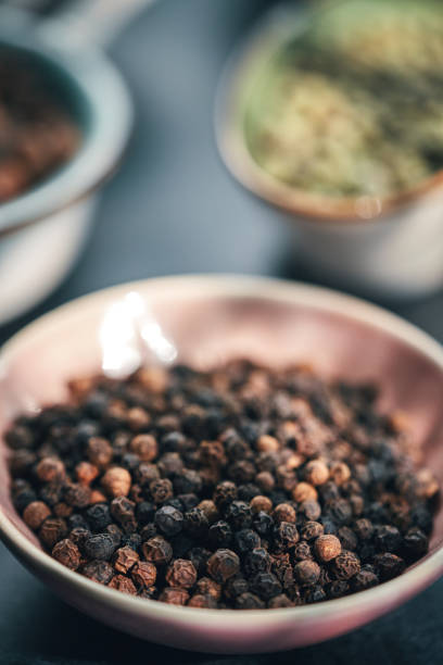 istock Green, White, Black and Mixed Peppercorns on a Spoon 1407365063