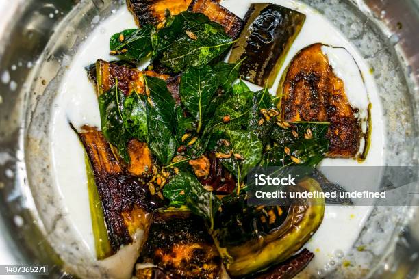 Indian Special Food Brinjal Curd Curry With Awesome Taste Looking Awesome In Oil Fried By Curry Leafs Red Chili Cumin Mustard Seeds Fenugreek Seed Stock Photo - Download Image Now