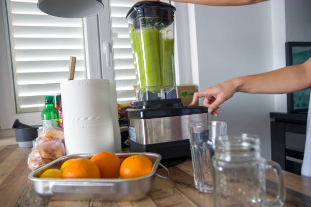 istock Making a smoothie in an electric mixer 1407365422