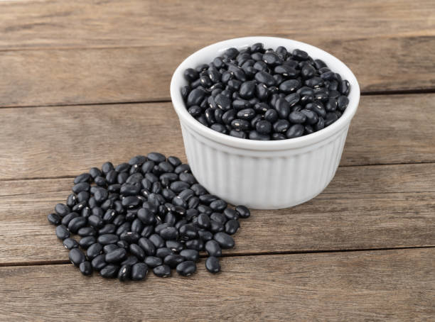 istock Black beans in a bowl over wooden table 1407366118