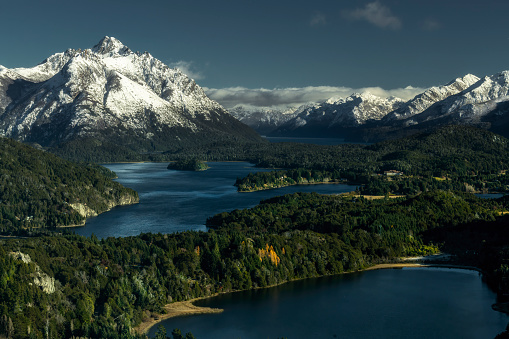 Argentina patagonia landscape with snow capped mountains, lakes, trees and snow