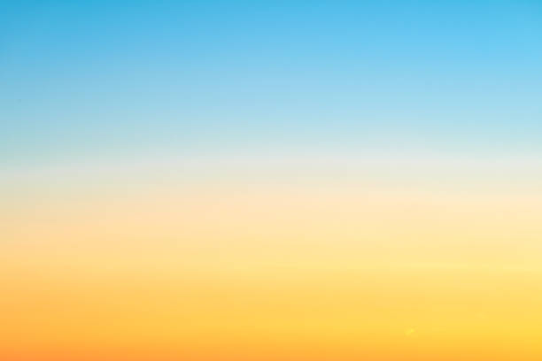 istock Sunrise orange-blue sky gradient, clear sky without clouds. Beautiful red and light blue sky, copy space for text 1407368087