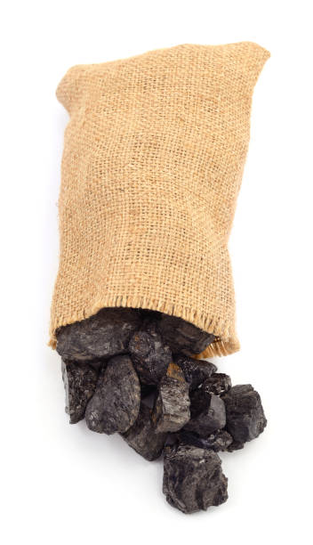 Coal in a bag. Coal in a bag isolated on a white background. hard bituminous coal stock pictures, royalty-free photos & images