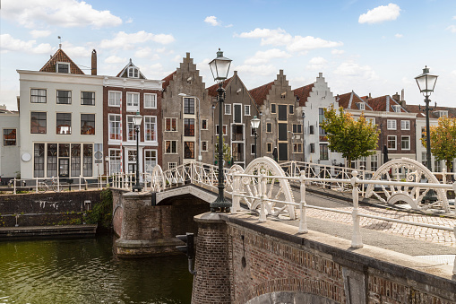 Amsterdam, Netherlands - 04 17 2016: Keizersgracht canal bridges in Amsterdam, Netherlands. Amsterdam \nis home to more than one hundred kilometres of canals, most of which are navigable by boat.