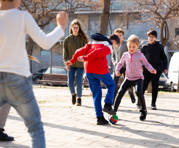 istock Children playing soccer with ball 1407371581