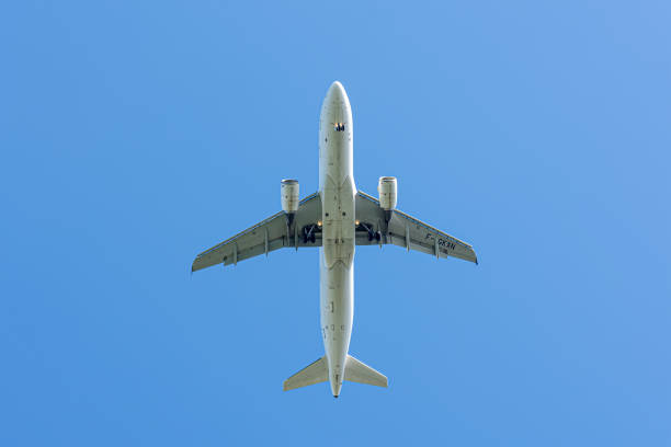 Flying aircraft view from below stock photo