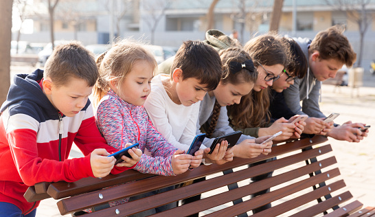 Children communicate via messengers on phones