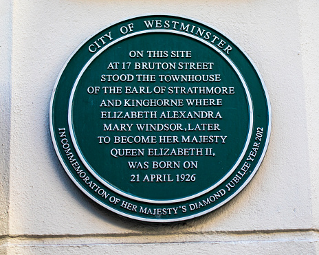 London, UK - March 8th 2022: A plaque on Bruton Street in central London, marking the location where Queen Elizabeth II was born in 1926.
