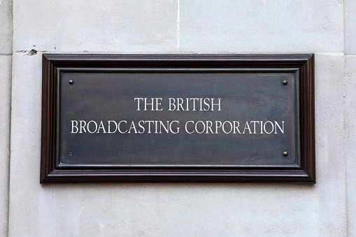 London, UK - March 8th 2022: The vintage sign on the exterior of Broadcasting House - the headquarters of the BBC, located on the corner of Portland Place and Langham Place in London, UK.