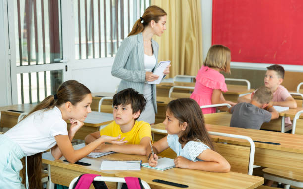 istock Tweens working in small groups during lesson at school 1407371941