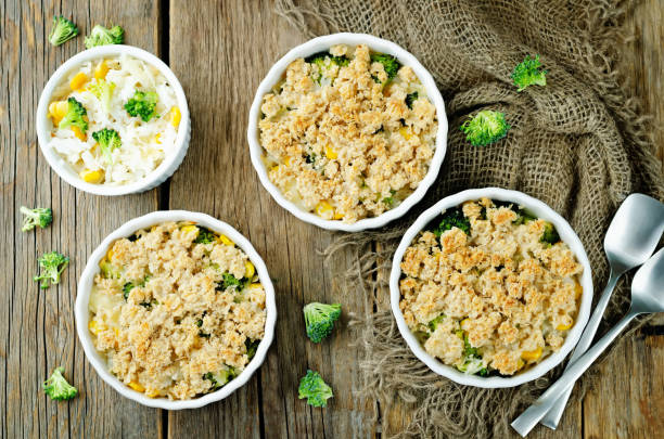 Broccoli corn rice casserole in a white plate stock photo
