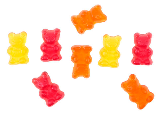 istock Colorful eat gummy bears isolated on a white background, top view. 1407375177