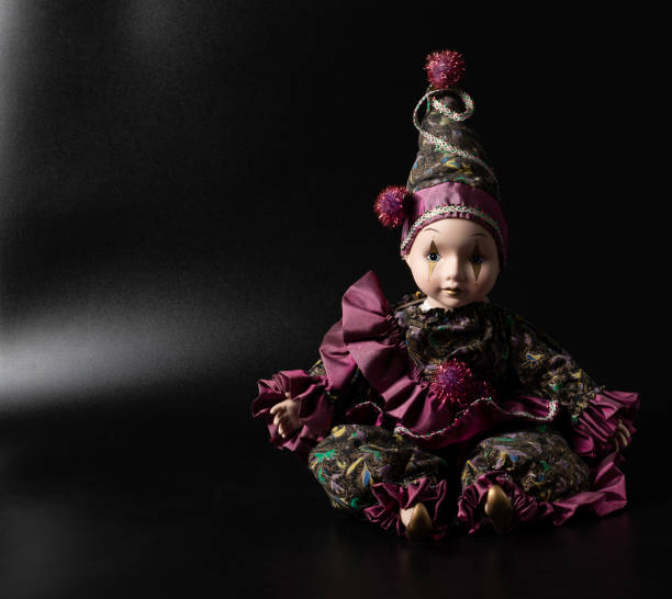 istock Amazing realistic porcelain doll, toy, harlequin 1407375413