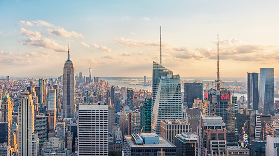 Aerial shot of the Lower Manhattan and the Freedom Tower reflecting the clouds. Shot in USA.