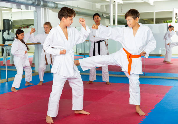 istock Girls and boys sparring during karate training 1407380202