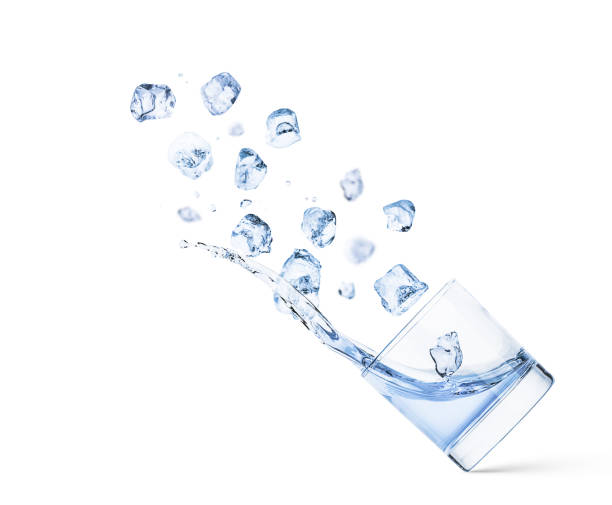 istock Ice Cubes Falling In Cold Water With Splash of a clear glass 1407380757