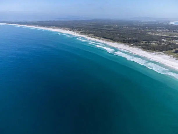 Wonderful coast of the Atlantic Ocean in the midst of nature, mountains, forests and a small coastal town. Drone aerial view. Arraial do Cabo, Rio de Janeiro, Brazil