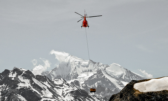 Carrying supplies, over the Swiss Alps in early summer