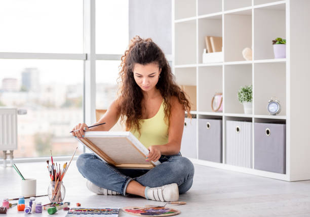 istock Cute girl painting in workshop 1407390546