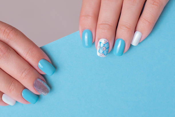 istock Female hands with romantic manicure nails 1407390611