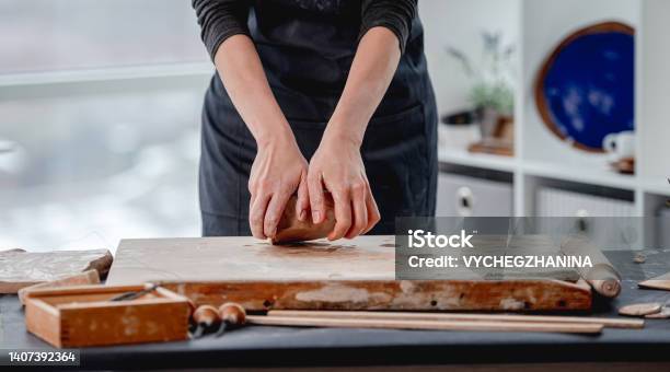Womanworking With Clay At Pottery Workshop Stock Photo - Download Image Now - Adult, Adults Only, Apron