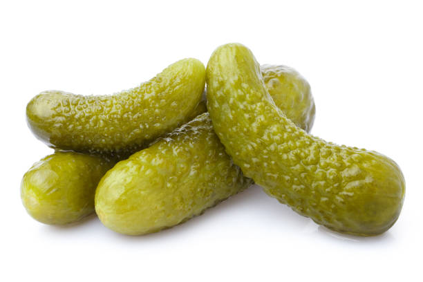 istock Delicious marinated pickled cucumbers on white 1407398815